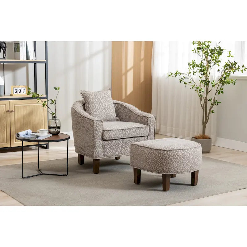 Fauteuil tonneau rembourré avec pouf