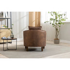 Fauteuil tonneau rembourré avec pouf